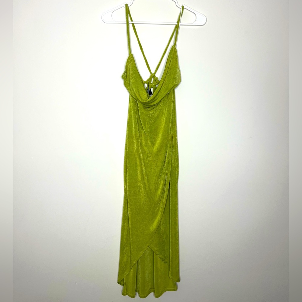 Mid length dress with strappy back. Color Green. Size L